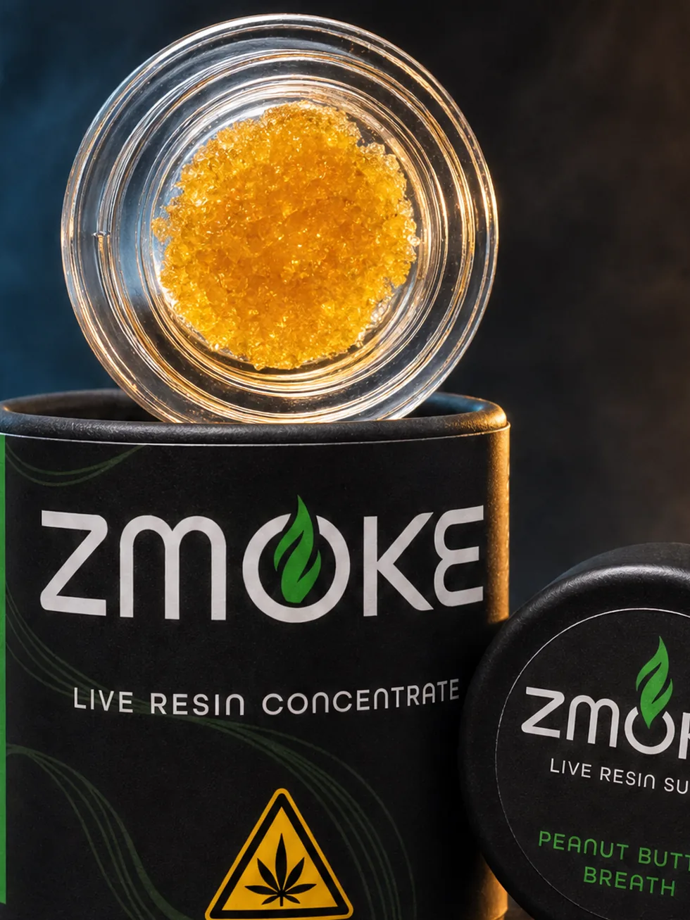 Green Hybrid ZMOKE live resin concentrate packaging staged on dark slate