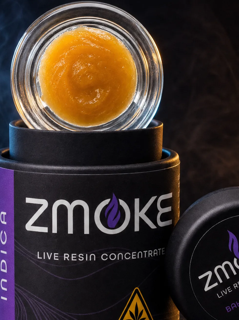 Purple Indica ZMOKE live resin concentrate packaging staged on dark slate